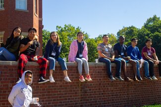 DLR participants posing sitting on a wall